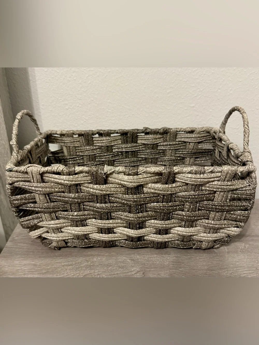 Allen +Roth . This small, grey decorative basket by allen + roth is made of poly